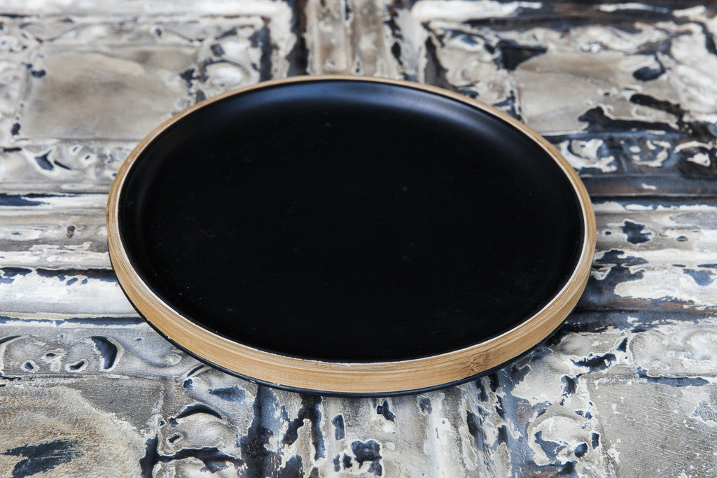 black porcelain and bamboo plate