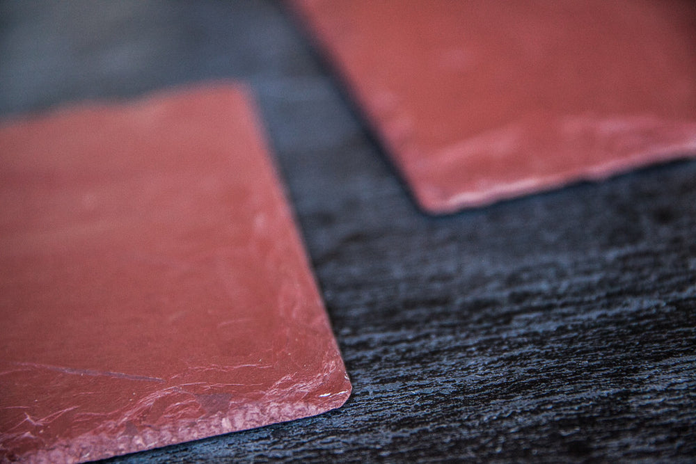 Rossa, red in Italian, is a platter & cheese board made with red slate by Just Slate, a UK-based company specialized in working only with the best-quality material. Rough-hewn red slate is much rarer than its dark grey counterpart. This red slate boards is easy, casual and fun; unleash your creativity to design beautiful table settings.  Extremely versatile, the Rossa red slate cheese board has the power to enhance the color and tone of any type of food from the four corners of the world: appetizers, meat,