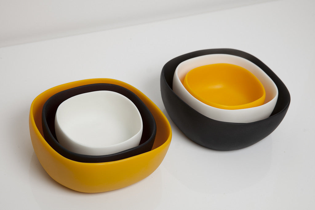 Yellow, Black, and White resin bowls