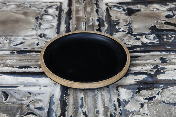 black porcelain and bamboo plate